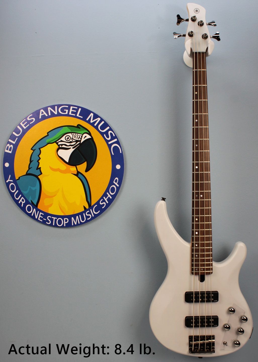 Yamaha TRBX304 4-string bass white landing photo