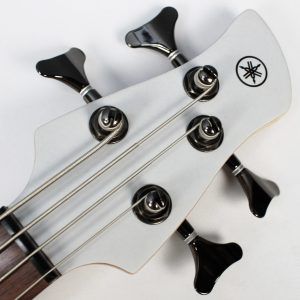 Yamaha TRBX304 4-string bass white front of headstock