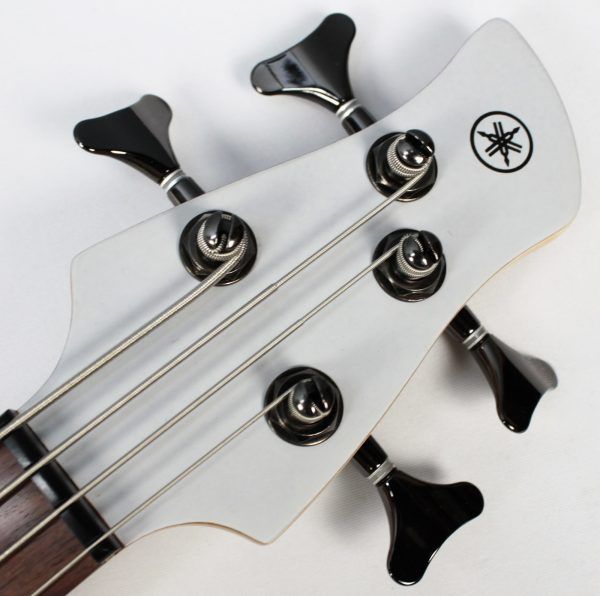 Yamaha TRBX304 4-string bass white front of headstock