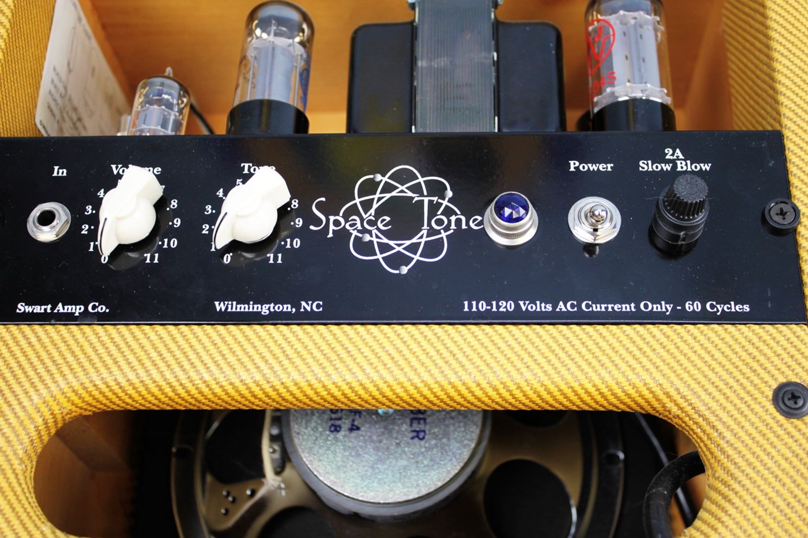 Close-up of the amp’s top control panel featuring knobs, input jack, and tube layout.