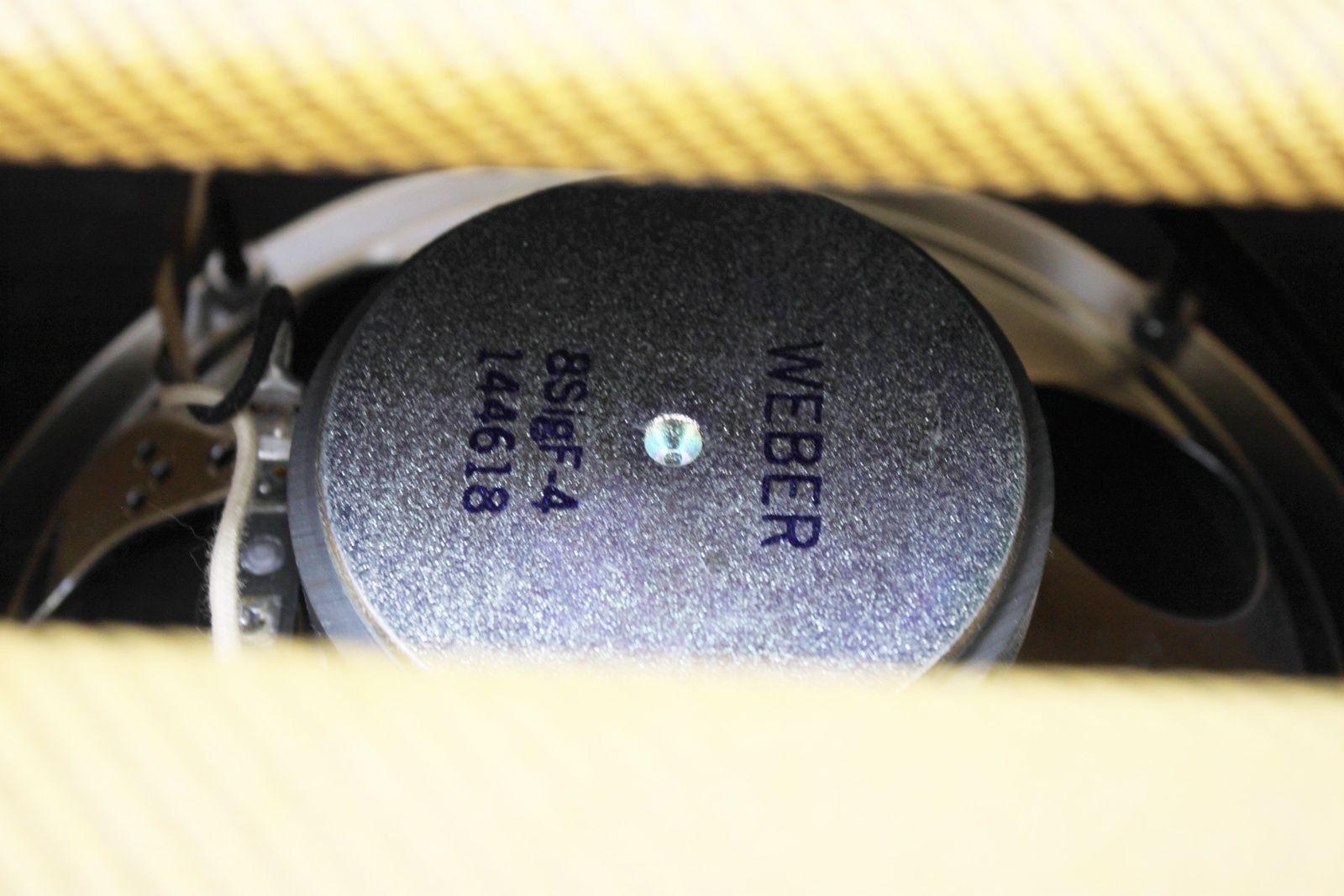 Rear view of the Swart Space Tone Atomic Jr showing the open-back design, tubes, and Weber Ceramic Sig 8 speaker.