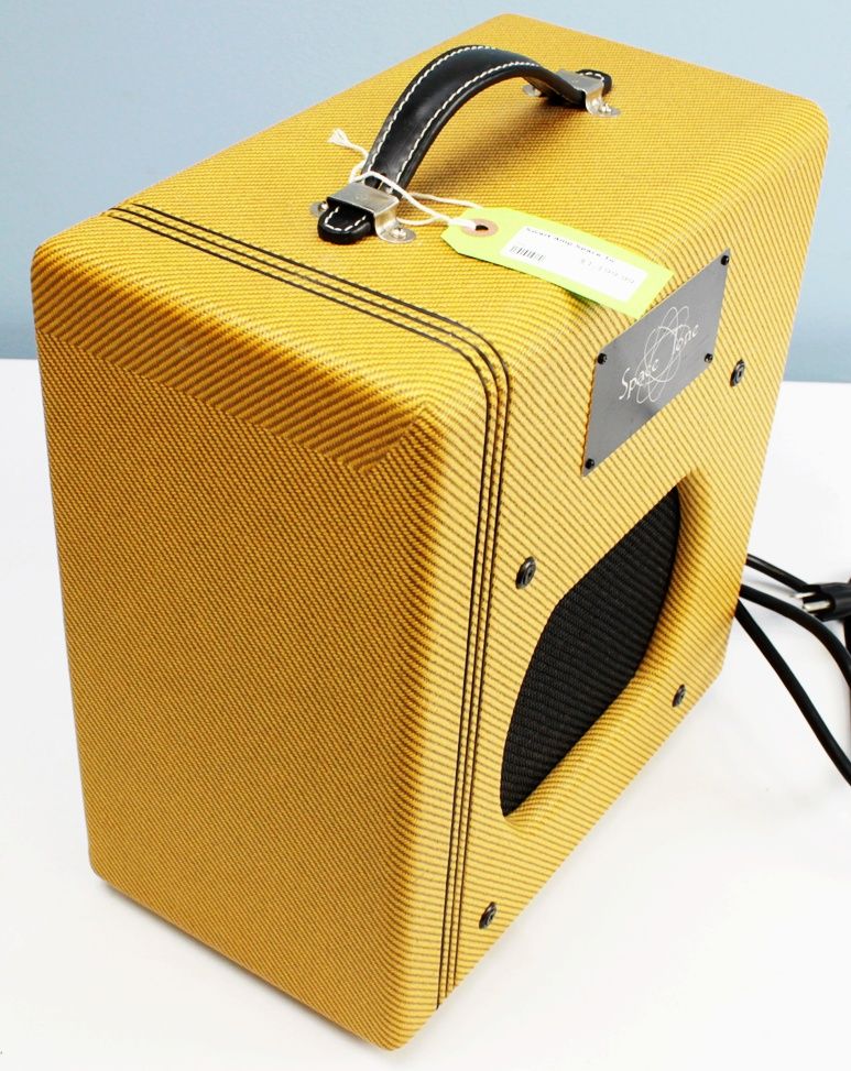 Angled front-right view of the Swart Space Tone Atomic Jr highlighting the tweed finish and finger-jointed pine cabinet.