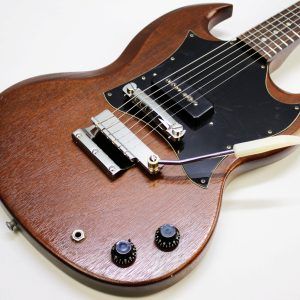 Gibson SG Junior, Gibson SG Junior Large Guard, Early 70s Gibson SG, 1970s Gibson SG Junior, Vintage Gibson SG, Gibson SG Natural Finish, Natural SG Junior, Gibson P90, Vintage P90 Guitar, Gibson Solid Body Electric Guitar, Made in USA Gibson, Vintage Gibson Electric, Large Pickguard SG, Norlin Era Gibson, Classic Rock Guitar, Blues Guitar, Vintage Guitar, Collector Grade Guitar, Player Grade Vintage Guitar, Resonant SG Junior, Chunky Neck Gibson, Single Pickup Gibson, Gibson Junior Model, Vintage SG Player, Early 70s SG, Natural Finish Gibson SG, Gibson SG Junior Natural, Amazing Player, Ready to Go, Vintage Electric Guitar, USA Made Guitar, Gibson Guitar, Retro Rock Guitar, Classic Gibson Tone, Vintage P90 Tone, SG Junior Large Guard Natural, Early 1970s Gibson SG Junior, Vintage Gibson USA, Natural Wood Grain SG, Gibson SG Single Cutaway, Gig Ready Guitar