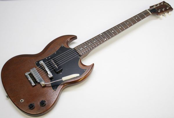 Gibson SG Junior, Gibson SG Junior Large Guard, Early 70s Gibson SG, 1970s Gibson SG Junior, Vintage Gibson SG, Gibson SG Natural Finish, Natural SG Junior, Gibson P90, Vintage P90 Guitar, Gibson Solid Body Electric Guitar, Made in USA Gibson, Vintage Gibson Electric, Large Pickguard SG, Norlin Era Gibson, Classic Rock Guitar, Blues Guitar, Vintage Guitar, Collector Grade Guitar, Player Grade Vintage Guitar, Resonant SG Junior, Chunky Neck Gibson, Single Pickup Gibson, Gibson Junior Model, Vintage SG Player, Early 70s SG, Natural Finish Gibson SG, Gibson SG Junior Natural, Amazing Player, Ready to Go, Vintage Electric Guitar, USA Made Guitar, Gibson Guitar, Retro Rock Guitar, Classic Gibson Tone, Vintage P90 Tone, SG Junior Large Guard Natural, Early 1970s Gibson SG Junior, Vintage Gibson USA, Natural Wood Grain SG, Gibson SG Single Cutaway, Gig Ready Guitar