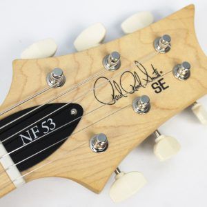 PRS SE NF 53 2025 - Present - Black Doghair front of headstock with large new PRS tuners