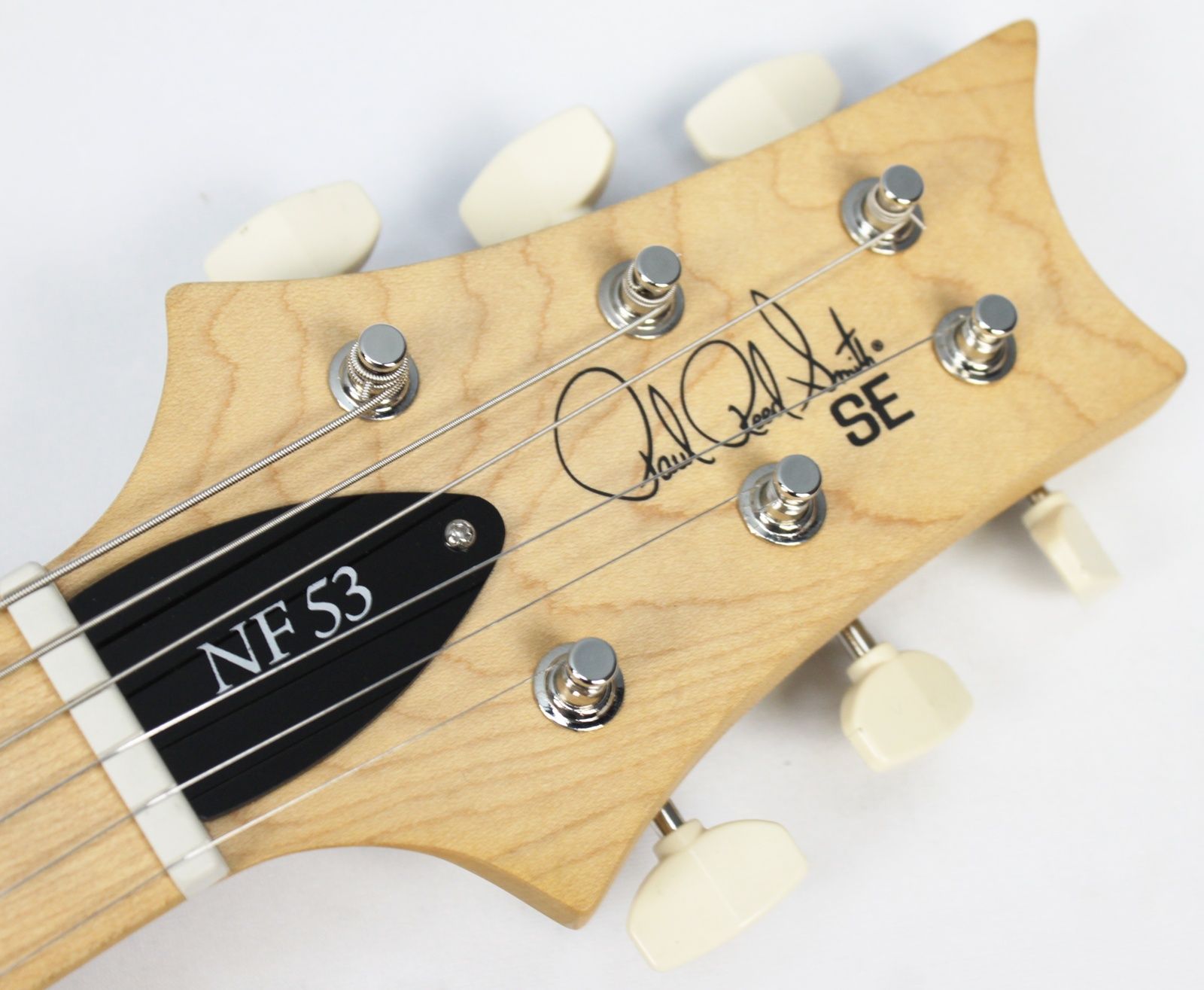 PRS SE NF 53 2025 - Present - Black Doghair front of headstock with large new PRS tuners