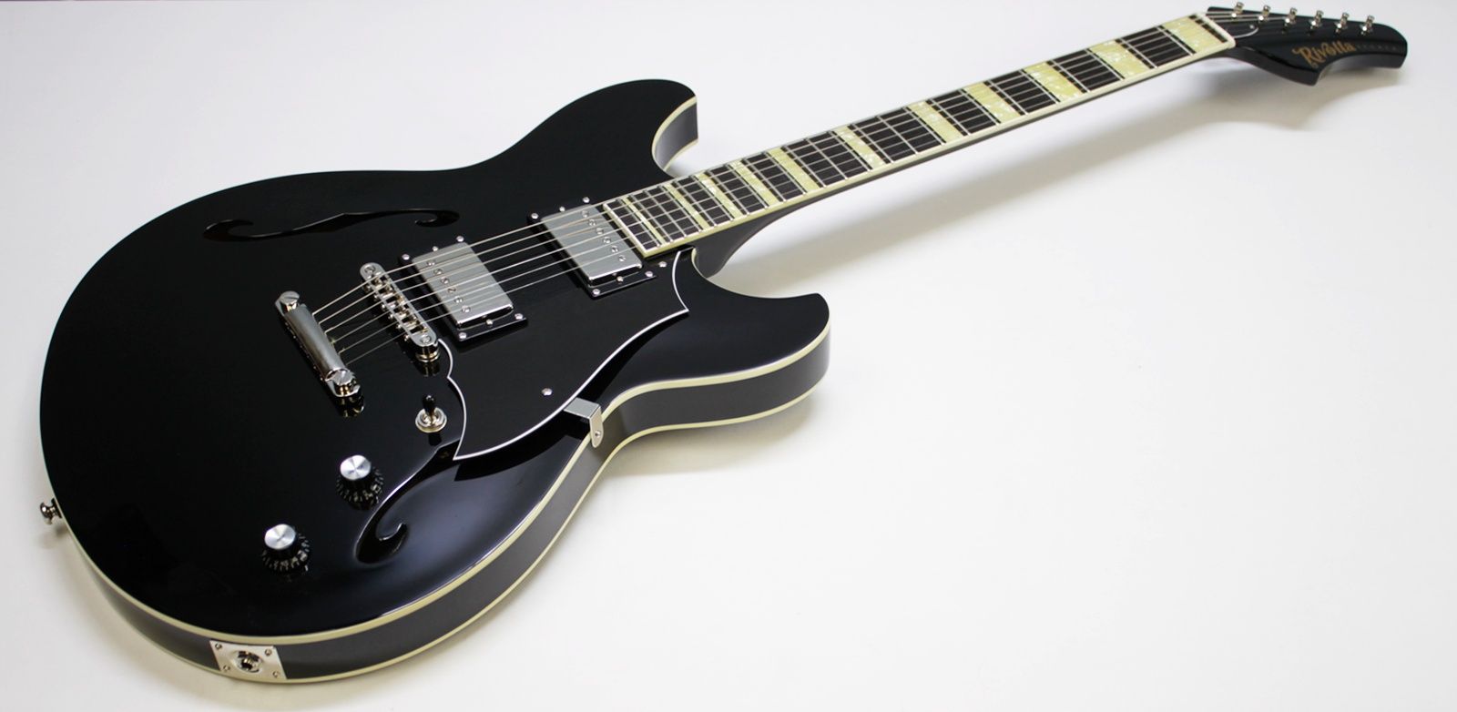 Rivolta Regata VII, Rivolta Guitars, Regata VII, Toro Black, 2021 Rivolta, semi-hollow guitar, electric guitar, offset guitar, dual humbuckers, Brevetto humbuckers, ebony fretboard, mahogany neck, maple body, center block guitar, set neck, 24 frets, boutique guitar, retro style guitar, Korean made guitar, nickel hardware, Tune-O-Matic bridge, stoptail tailpiece, black finish, Rivolta Mondata, Dennis Fano design, Fano inspired guitar, modern vintage guitar, alternative rock guitar, indie guitar, blues guitar, jazz guitar, collectible guitar, premium electric guitar