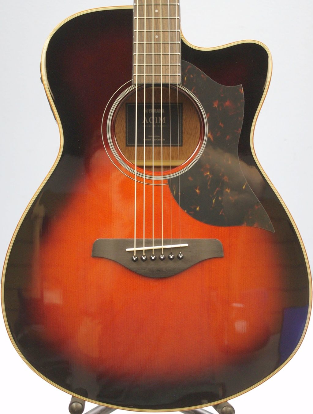 Yamaha AC1M-TBS Solid Sitka Spruce/Mahogany Concert Cutaway with Electronics - Tobacco Brown Sunburst front of body dead on