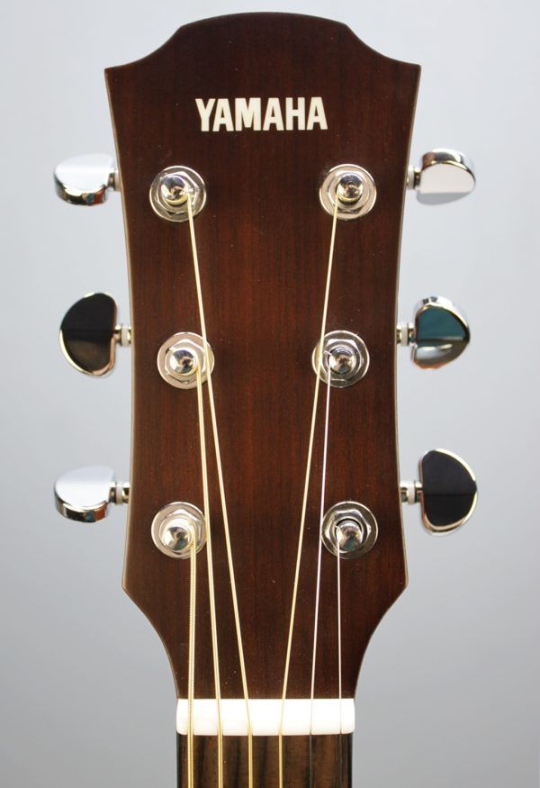 Yamaha AC1M-TBS Solid Sitka Spruce/Mahogany Concert Cutaway with Electronics - Tobacco Brown Sunburst front facing headstock