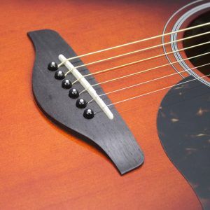 Yamaha AC1M-TBS Solid Sitka Spruce/Mahogany Concert Cutaway with Electronics - Tobacco Brown Sunburst bridge