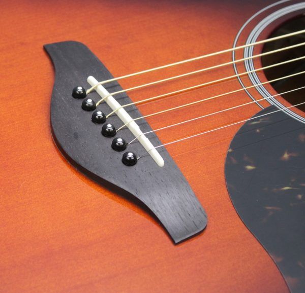 Yamaha AC1M-TBS Solid Sitka Spruce/Mahogany Concert Cutaway with Electronics - Tobacco Brown Sunburst bridge