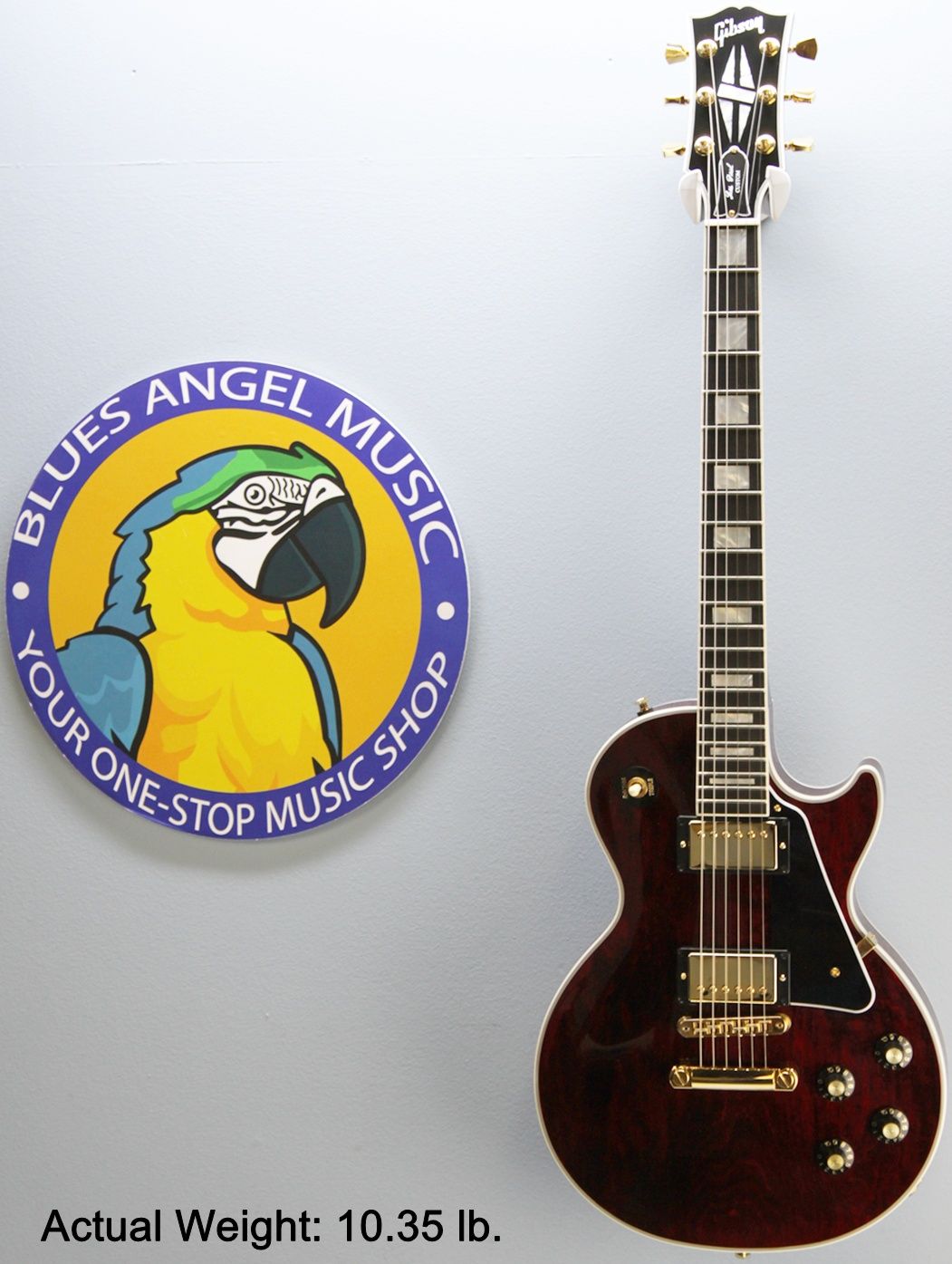 Gibson, Les Paul Custom, Les Paul Custom 70s, Gibson Les Paul Custom, Wine Red, 2025 Gibson, electric guitar, solid body guitar, mahogany body, maple top, set neck, 70s profile neck, volute neck, ebony fingerboard, nitrocellulose lacquer, dual humbuckers, gold hardware, rock guitar, blues guitar, hard rock, classic rock, premium electric guitar, USA made guitar, Gibson USA, 6 string guitar, carved maple top, wine red finish, custom series, Les Paul electric, vintage style guitar, modern classic guitar