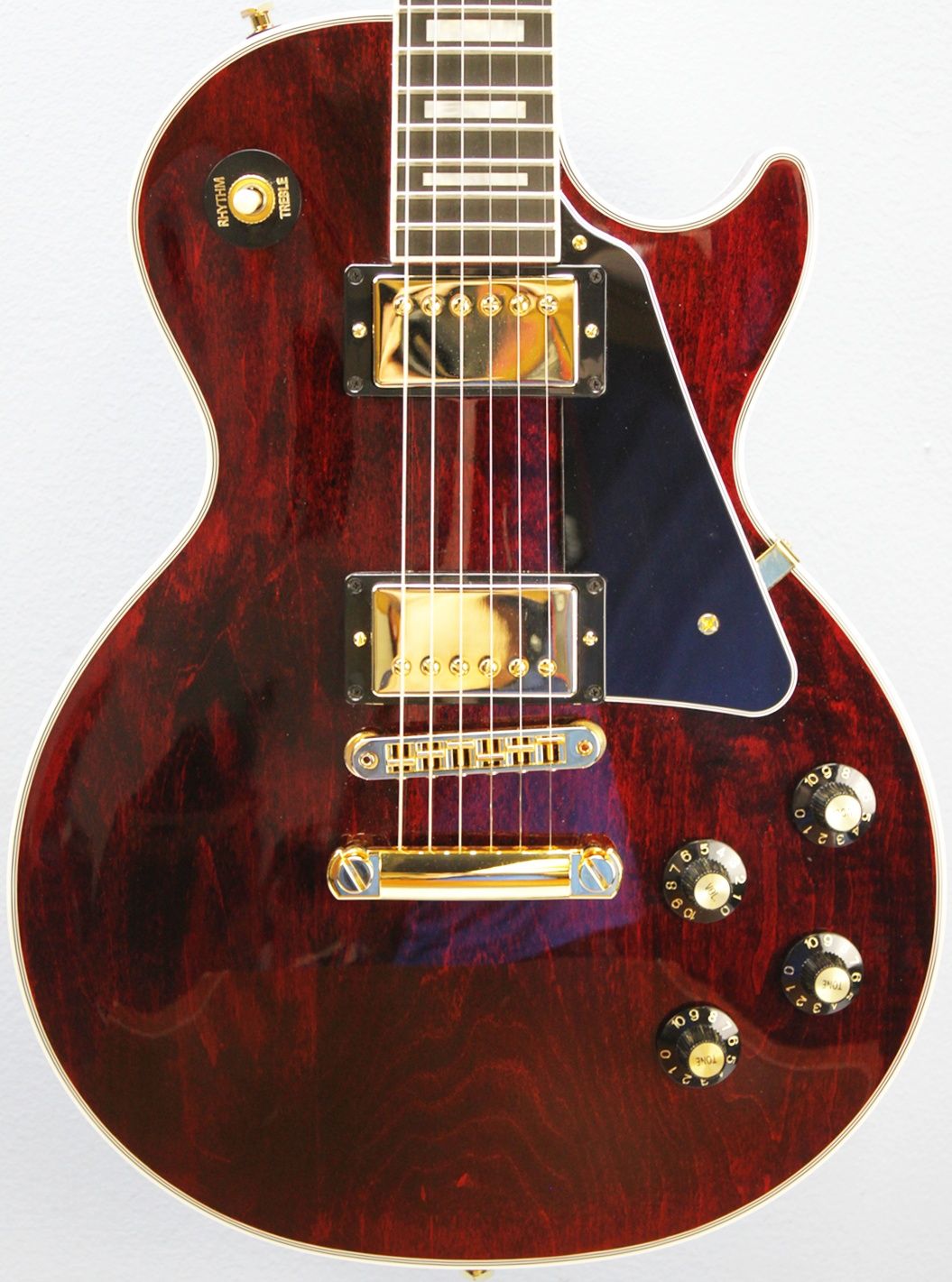 Gibson, Les Paul Custom, Les Paul Custom 70s, Gibson Les Paul Custom, Wine Red, 2025 Gibson, electric guitar, solid body guitar, mahogany body, maple top, set neck, 70s profile neck, volute neck, ebony fingerboard, nitrocellulose lacquer, dual humbuckers, gold hardware, rock guitar, blues guitar, hard rock, classic rock, premium electric guitar, USA made guitar, Gibson USA, 6 string guitar, carved maple top, wine red finish, custom series, Les Paul electric, vintage style guitar, modern classic guitar