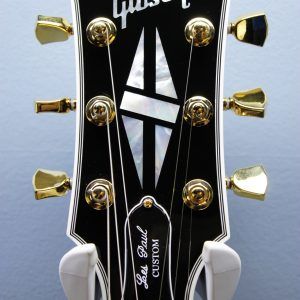 Gibson, Les Paul Custom, Les Paul Custom 70s, Gibson Les Paul Custom, Wine Red, 2025 Gibson, electric guitar, solid body guitar, mahogany body, maple top, set neck, 70s profile neck, volute neck, ebony fingerboard, nitrocellulose lacquer, dual humbuckers, gold hardware, rock guitar, blues guitar, hard rock, classic rock, premium electric guitar, USA made guitar, Gibson USA, 6 string guitar, carved maple top, wine red finish, custom series, Les Paul electric, vintage style guitar, modern classic guitar