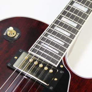 Gibson, Les Paul Custom, Les Paul Custom 70s, Gibson Les Paul Custom, Wine Red, 2025 Gibson, electric guitar, solid body guitar, mahogany body, maple top, set neck, 70s profile neck, volute neck, ebony fingerboard, nitrocellulose lacquer, dual humbuckers, gold hardware, rock guitar, blues guitar, hard rock, classic rock, premium electric guitar, USA made guitar, Gibson USA, 6 string guitar, carved maple top, wine red finish, custom series, Les Paul electric, vintage style guitar, modern classic guitar