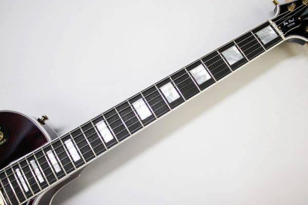 Gibson, Les Paul Custom, Les Paul Custom 70s, Gibson Les Paul Custom, Wine Red, 2025 Gibson, electric guitar, solid body guitar, mahogany body, maple top, set neck, 70s profile neck, volute neck, ebony fingerboard, nitrocellulose lacquer, dual humbuckers, gold hardware, rock guitar, blues guitar, hard rock, classic rock, premium electric guitar, USA made guitar, Gibson USA, 6 string guitar, carved maple top, wine red finish, custom series, Les Paul electric, vintage style guitar, modern classic guitar