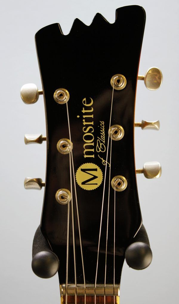 Mosrite, Ventures Model, Mk I, Fillmore, early 2000s, Sunburst, upgraded electronics, upgraded tremolo arm, vintage style guitar, offset electric guitar, surf rock guitar, collectible guitar, rare Mosrite, Japanese guitar, retro guitar, tremolo bridge, bolt-on neck, dual pickup guitar, classic sunburst finish, vintage inspired, player grade guitar, modded Mosrite, Ventures guitar, surf music, electric guitar, preowned guitar, stage ready guitar
