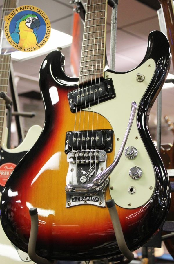 Mosrite, Ventures Model, Mk I, Fillmore, early 2000s, Sunburst, upgraded electronics, upgraded tremolo arm, vintage style guitar, offset electric guitar, surf rock guitar, collectible guitar, rare Mosrite, Japanese guitar, retro guitar, tremolo bridge, bolt-on neck, dual pickup guitar, classic sunburst finish, vintage inspired, player grade guitar, modded Mosrite, Ventures guitar, surf music, electric guitar, preowned guitar, stage ready guitar