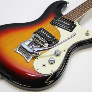 Mosrite, Ventures Model, Mk I, Fillmore, early 2000s, Sunburst, upgraded electronics, upgraded tremolo arm, vintage style guitar, offset electric guitar, surf rock guitar, collectible guitar, rare Mosrite, Japanese guitar, retro guitar, tremolo bridge, bolt-on neck, dual pickup guitar, classic sunburst finish, vintage inspired, player grade guitar, modded Mosrite, Ventures guitar, surf music, electric guitar, preowned guitar, stage ready guitar