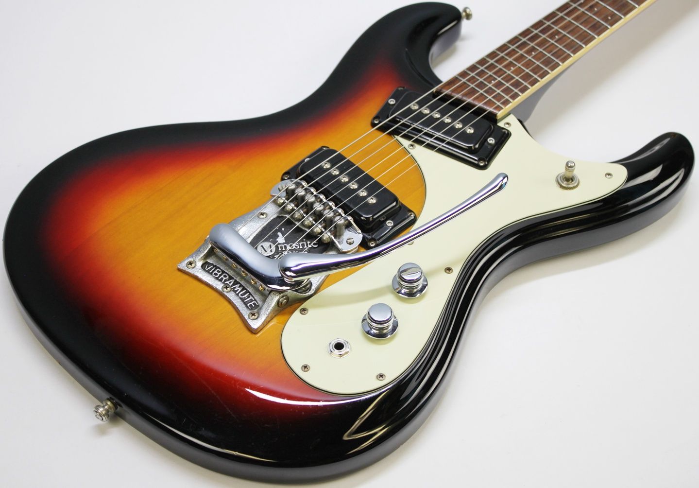 Mosrite, Ventures Model, Mk I, Fillmore, early 2000s, Sunburst, upgraded electronics, upgraded tremolo arm, vintage style guitar, offset electric guitar, surf rock guitar, collectible guitar, rare Mosrite, Japanese guitar, retro guitar, tremolo bridge, bolt-on neck, dual pickup guitar, classic sunburst finish, vintage inspired, player grade guitar, modded Mosrite, Ventures guitar, surf music, electric guitar, preowned guitar, stage ready guitar