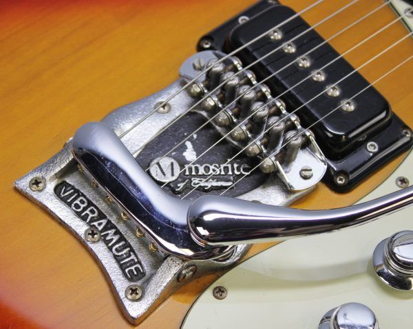 Mosrite, Ventures Model, Mk I, Fillmore, early 2000s, Sunburst, upgraded electronics, upgraded tremolo arm, vintage style guitar, offset electric guitar, surf rock guitar, collectible guitar, rare Mosrite, Japanese guitar, retro guitar, tremolo bridge, bolt-on neck, dual pickup guitar, classic sunburst finish, vintage inspired, player grade guitar, modded Mosrite, Ventures guitar, surf music, electric guitar, preowned guitar, stage ready guitar