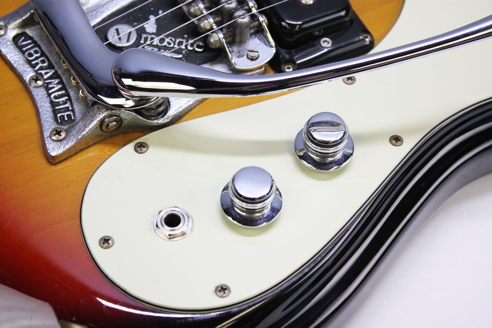 Mosrite, Ventures Model, Mk I, Fillmore, early 2000s, Sunburst, upgraded electronics, upgraded tremolo arm, vintage style guitar, offset electric guitar, surf rock guitar, collectible guitar, rare Mosrite, Japanese guitar, retro guitar, tremolo bridge, bolt-on neck, dual pickup guitar, classic sunburst finish, vintage inspired, player grade guitar, modded Mosrite, Ventures guitar, surf music, electric guitar, preowned guitar, stage ready guitar