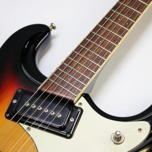 Mosrite, Ventures Model, Mk I, Fillmore, early 2000s, Sunburst, upgraded electronics, upgraded tremolo arm, vintage style guitar, offset electric guitar, surf rock guitar, collectible guitar, rare Mosrite, Japanese guitar, retro guitar, tremolo bridge, bolt-on neck, dual pickup guitar, classic sunburst finish, vintage inspired, player grade guitar, modded Mosrite, Ventures guitar, surf music, electric guitar, preowned guitar, stage ready guitar