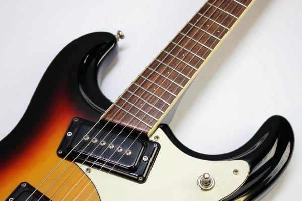 Mosrite, Ventures Model, Mk I, Fillmore, early 2000s, Sunburst, upgraded electronics, upgraded tremolo arm, vintage style guitar, offset electric guitar, surf rock guitar, collectible guitar, rare Mosrite, Japanese guitar, retro guitar, tremolo bridge, bolt-on neck, dual pickup guitar, classic sunburst finish, vintage inspired, player grade guitar, modded Mosrite, Ventures guitar, surf music, electric guitar, preowned guitar, stage ready guitar