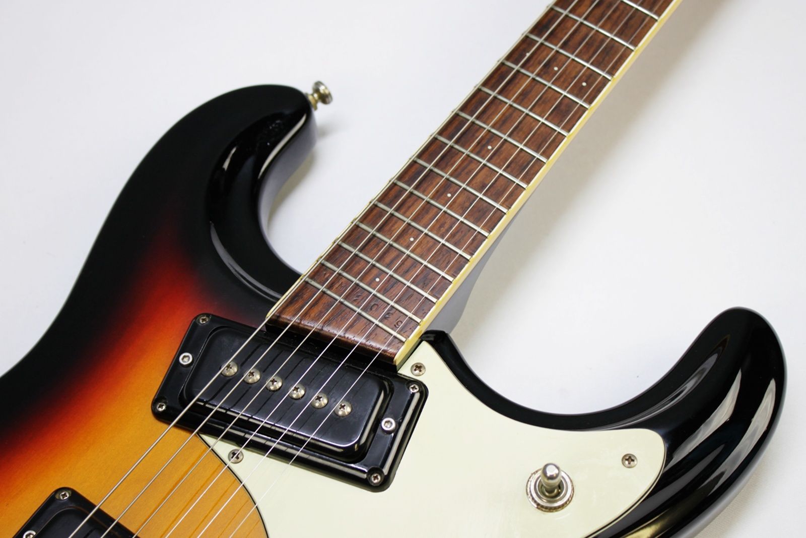 Mosrite, Ventures Model, Mk I, Fillmore, early 2000s, Sunburst, upgraded electronics, upgraded tremolo arm, vintage style guitar, offset electric guitar, surf rock guitar, collectible guitar, rare Mosrite, Japanese guitar, retro guitar, tremolo bridge, bolt-on neck, dual pickup guitar, classic sunburst finish, vintage inspired, player grade guitar, modded Mosrite, Ventures guitar, surf music, electric guitar, preowned guitar, stage ready guitar