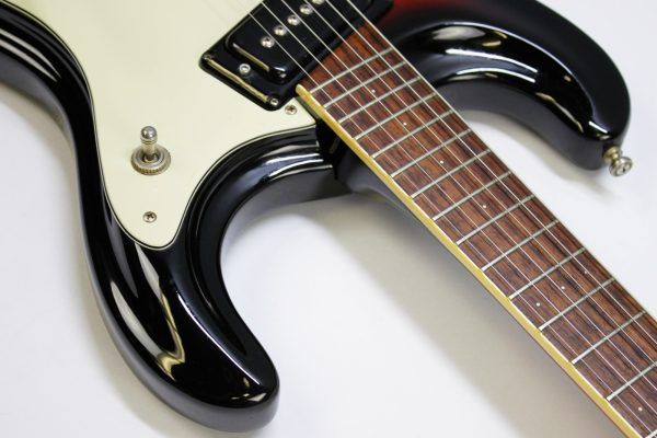 Mosrite, Ventures Model, Mk I, Fillmore, early 2000s, Sunburst, upgraded electronics, upgraded tremolo arm, vintage style guitar, offset electric guitar, surf rock guitar, collectible guitar, rare Mosrite, Japanese guitar, retro guitar, tremolo bridge, bolt-on neck, dual pickup guitar, classic sunburst finish, vintage inspired, player grade guitar, modded Mosrite, Ventures guitar, surf music, electric guitar, preowned guitar, stage ready guitar