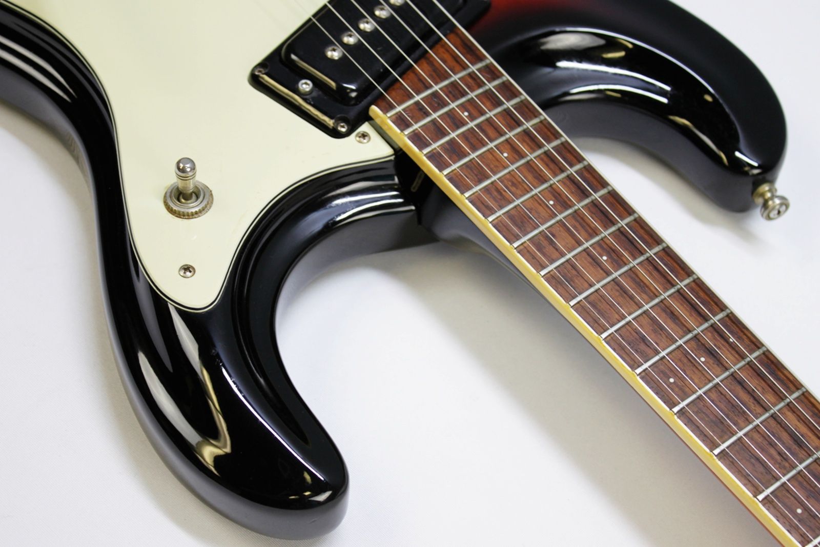 Mosrite, Ventures Model, Mk I, Fillmore, early 2000s, Sunburst, upgraded electronics, upgraded tremolo arm, vintage style guitar, offset electric guitar, surf rock guitar, collectible guitar, rare Mosrite, Japanese guitar, retro guitar, tremolo bridge, bolt-on neck, dual pickup guitar, classic sunburst finish, vintage inspired, player grade guitar, modded Mosrite, Ventures guitar, surf music, electric guitar, preowned guitar, stage ready guitar