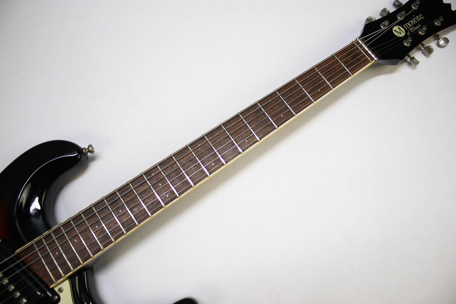 Mosrite, Ventures Model, Mk I, Fillmore, early 2000s, Sunburst, upgraded electronics, upgraded tremolo arm, vintage style guitar, offset electric guitar, surf rock guitar, collectible guitar, rare Mosrite, Japanese guitar, retro guitar, tremolo bridge, bolt-on neck, dual pickup guitar, classic sunburst finish, vintage inspired, player grade guitar, modded Mosrite, Ventures guitar, surf music, electric guitar, preowned guitar, stage ready guitar