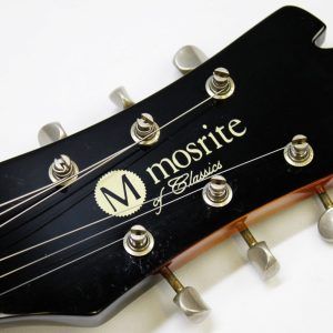 Mosrite, Ventures Model, Mk I, Fillmore, early 2000s, Sunburst, upgraded electronics, upgraded tremolo arm, vintage style guitar, offset electric guitar, surf rock guitar, collectible guitar, rare Mosrite, Japanese guitar, retro guitar, tremolo bridge, bolt-on neck, dual pickup guitar, classic sunburst finish, vintage inspired, player grade guitar, modded Mosrite, Ventures guitar, surf music, electric guitar, preowned guitar, stage ready guitar