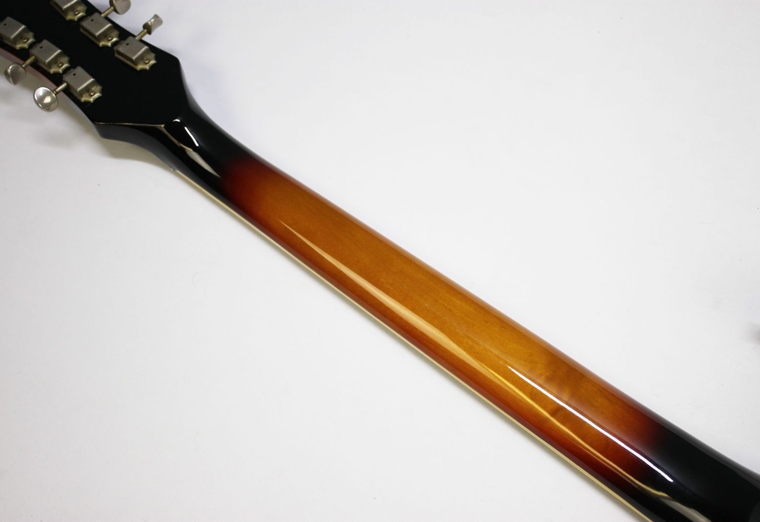 Mosrite, Ventures Model, Mk I, Fillmore, early 2000s, Sunburst, upgraded electronics, upgraded tremolo arm, vintage style guitar, offset electric guitar, surf rock guitar, collectible guitar, rare Mosrite, Japanese guitar, retro guitar, tremolo bridge, bolt-on neck, dual pickup guitar, classic sunburst finish, vintage inspired, player grade guitar, modded Mosrite, Ventures guitar, surf music, electric guitar, preowned guitar, stage ready guitar