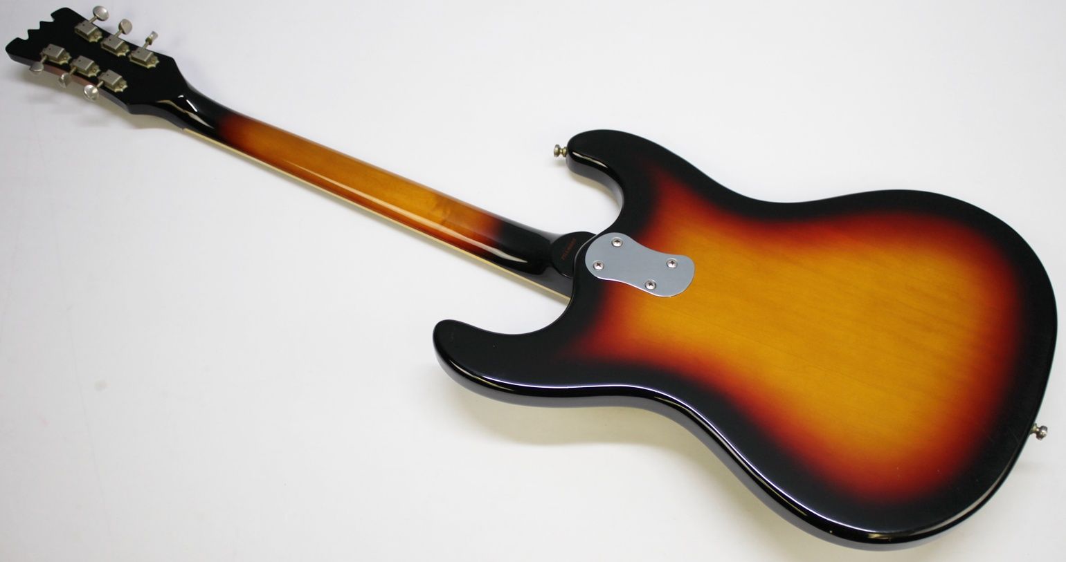 Mosrite, Ventures Model, Mk I, Fillmore, early 2000s, Sunburst, upgraded electronics, upgraded tremolo arm, vintage style guitar, offset electric guitar, surf rock guitar, collectible guitar, rare Mosrite, Japanese guitar, retro guitar, tremolo bridge, bolt-on neck, dual pickup guitar, classic sunburst finish, vintage inspired, player grade guitar, modded Mosrite, Ventures guitar, surf music, electric guitar, preowned guitar, stage ready guitar