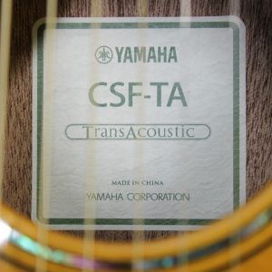 Yamaha CSF-TA VN, Yamaha CSF-TA, Yamaha TransAcoustic, Yamaha Parlor Guitar, Yamaha Acoustic Electric, CSF-TA Vintage Natural, Yamaha CSF TransAcoustic, Parlor Acoustic Guitar, Compact Acoustic Guitar, Sitka Spruce Top, Mahogany Back and Sides, Rosewood Fingerboard, System 70 TransAcoustic, SRT Piezo Pickup, Vintage Gloss Finish, Yamaha Acoustic Guitar, 6 String Acoustic, Travel Acoustic Guitar, Small Body Acoustic Guitar, Acoustic Electric Guitar, Elixir Strings, Yamaha CSF Series, Natural Finish Acoustic, Steel String Acoustic, Gig Bag Included