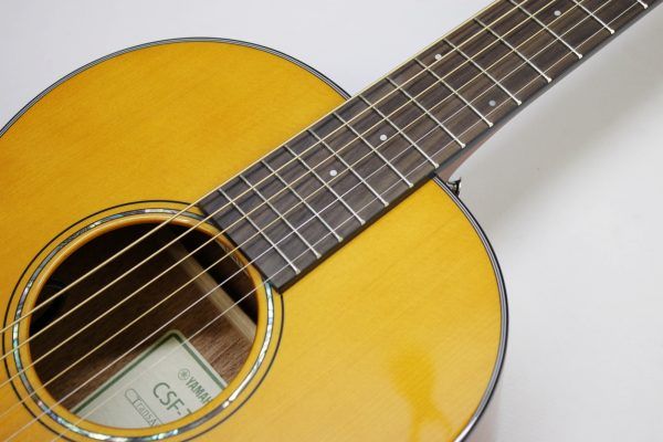 Yamaha CSF-TA VN, Yamaha CSF-TA, Yamaha TransAcoustic, Yamaha Parlor Guitar, Yamaha Acoustic Electric, CSF-TA Vintage Natural, Yamaha CSF TransAcoustic, Parlor Acoustic Guitar, Compact Acoustic Guitar, Sitka Spruce Top, Mahogany Back and Sides, Rosewood Fingerboard, System 70 TransAcoustic, SRT Piezo Pickup, Vintage Gloss Finish, Yamaha Acoustic Guitar, 6 String Acoustic, Travel Acoustic Guitar, Small Body Acoustic Guitar, Acoustic Electric Guitar, Elixir Strings, Yamaha CSF Series, Natural Finish Acoustic, Steel String Acoustic, Gig Bag Included