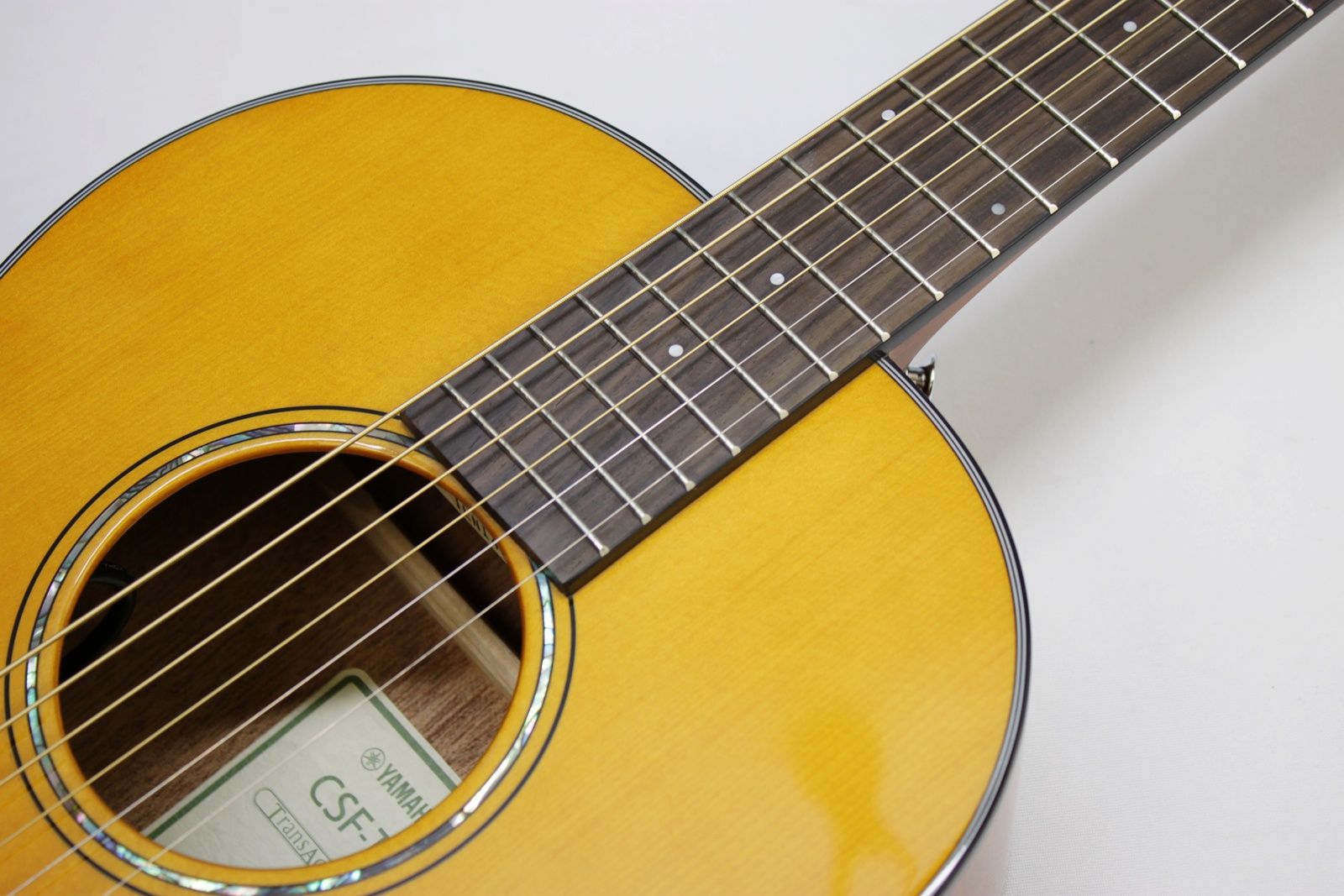 Yamaha CSF-TA VN, Yamaha CSF-TA, Yamaha TransAcoustic, Yamaha Parlor Guitar, Yamaha Acoustic Electric, CSF-TA Vintage Natural, Yamaha CSF TransAcoustic, Parlor Acoustic Guitar, Compact Acoustic Guitar, Sitka Spruce Top, Mahogany Back and Sides, Rosewood Fingerboard, System 70 TransAcoustic, SRT Piezo Pickup, Vintage Gloss Finish, Yamaha Acoustic Guitar, 6 String Acoustic, Travel Acoustic Guitar, Small Body Acoustic Guitar, Acoustic Electric Guitar, Elixir Strings, Yamaha CSF Series, Natural Finish Acoustic, Steel String Acoustic, Gig Bag Included