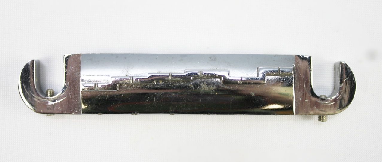 Ibanez Wrap-Around Bridge, Ibanez Bridge, Vintage Ibanez Bridge, 1970s Ibanez Parts, 70s Ibanez Hardware, Wraparound Tailpiece, Wrap Around Bridge, Gibson Melody Maker Style Bridge, Melody Maker Bridge, Vintage Guitar Bridge, Electric Guitar Bridge, Replacement Bridge, Guitar Hardware, Made in Japan Guitar Parts, MIJ Guitar Parts, Ibanez Vintage Hardware, Vintage Guitar Parts, Guitar Restoration Parts, Guitar Repair Parts, Wraparound Bridge Tailpiece, Classic Guitar Bridge, Rare Ibanez Part, Vintage MIJ Hardware, Ibanez Restoration, 1970s Guitar Hardware, Collectible Guitar Parts, Original Ibanez Part, Vintage Electric Guitar Parts, Guitar Upgrade, Luthier Parts, Bridge Assembly, Six String Guitar Bridge, Retro Guitar Hardware, Japan Vintage Guitar Parts, Ibanez Replacement Part, Vintage Wraparound Bridge, Gibson Style Bridge, Melody Maker Style Tailpiece, Guitar Bridge Upgrade, Vintage Instrument Parts, Ibanez Collectors Part