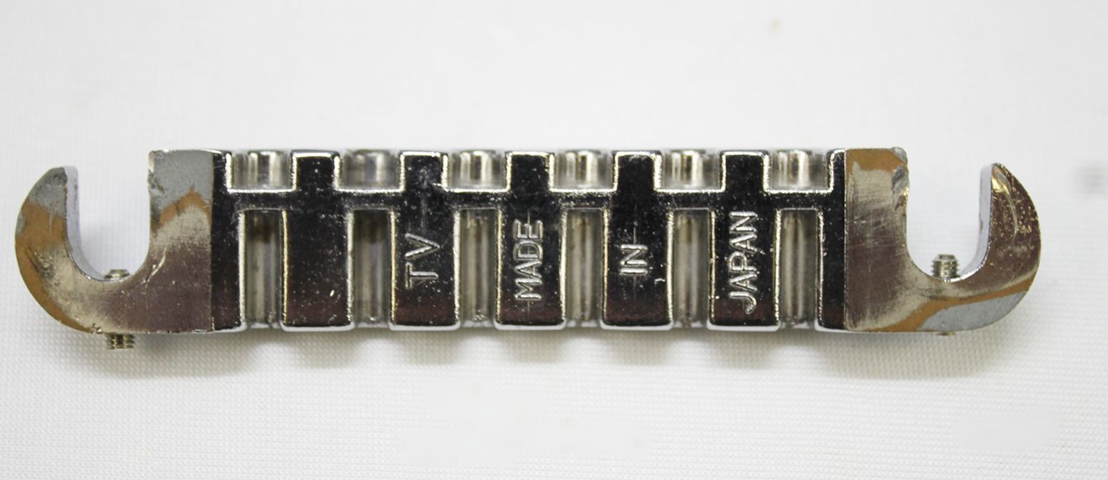 Ibanez Wrap-Around Bridge, Ibanez Bridge, Vintage Ibanez Bridge, 1970s Ibanez Parts, 70s Ibanez Hardware, Wraparound Tailpiece, Wrap Around Bridge, Gibson Melody Maker Style Bridge, Melody Maker Bridge, Vintage Guitar Bridge, Electric Guitar Bridge, Replacement Bridge, Guitar Hardware, Made in Japan Guitar Parts, MIJ Guitar Parts, Ibanez Vintage Hardware, Vintage Guitar Parts, Guitar Restoration Parts, Guitar Repair Parts, Wraparound Bridge Tailpiece, Classic Guitar Bridge, Rare Ibanez Part, Vintage MIJ Hardware, Ibanez Restoration, 1970s Guitar Hardware, Collectible Guitar Parts, Original Ibanez Part, Vintage Electric Guitar Parts, Guitar Upgrade, Luthier Parts, Bridge Assembly, Six String Guitar Bridge, Retro Guitar Hardware, Japan Vintage Guitar Parts, Ibanez Replacement Part, Vintage Wraparound Bridge, Gibson Style Bridge, Melody Maker Style Tailpiece, Guitar Bridge Upgrade, Vintage Instrument Parts, Ibanez Collectors Part